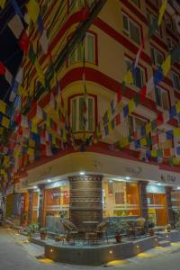 a building with colorful flags hanging from the ceiling at Hotel Tradition & Spa in Kathmandu