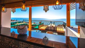 a restaurant with a view of the ocean at THE HORIZON in Taghazout