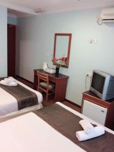 Katil atau katil-katil dalam bilik di Hotel Millenium
