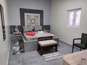 Rúm í herbergi á Curasita Colour Appartments & Resort - adres kaya Sucre nst 282
