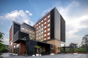 a rendering of a hotel with a building at Novotel Chandigarh Tribune Chowk in Chandīgarh