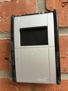 a cell phone is attached to a brick wall at Apartment Marit in Norden