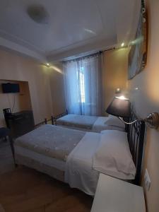Posteľ alebo postele v izbe v ubytovaní B&B Rome With Love