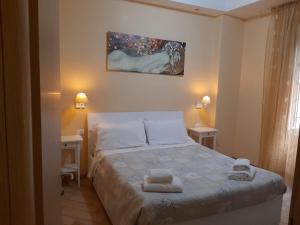 Posteľ alebo postele v izbe v ubytovaní B&B Rome With Love + 8 fotografií