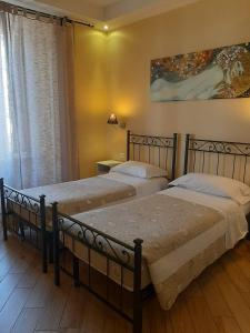 Posteľ alebo postele v izbe v ubytovaní B&B Rome With Love