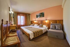 Postel nebo postele na pokoji v ubytování Hotel Victoria