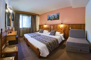 Postel nebo postele na pokoji v ubytování Hotel Victoria