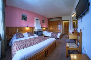 Postel nebo postele na pokoji v ubytování Hotel Victoria