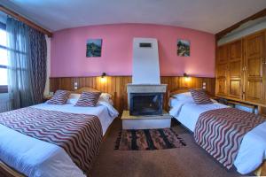 Postel nebo postele na pokoji v ubytování Hotel Victoria