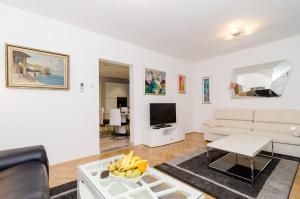 a living room with a couch and a table at Apartment Iva 31 in Dubrovnik