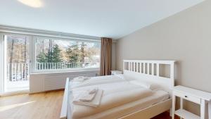 Postel nebo postele na pokoji v ubytování Abitaziun Crasta 1 - Pontresina