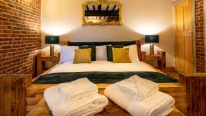 Ένα ή περισσότερα κρεβάτια σε δωμάτιο στο The Farmhouse at Fincham