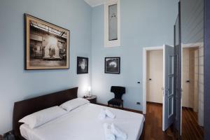 En eller flere senge i et værelse på La Casa del Fotografo