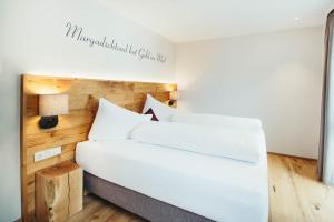 Posteľ alebo postele v izbe v ubytovaní adler alpen apartments