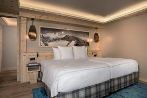 Postel nebo postele na pokoji v ubytování Hotel Seehof Davos