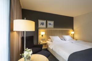 Ein Bett oder Betten in einem Zimmer der Unterkunft Maritim Hotel Würzburg