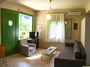TV a/nebo společenská místnost v ubytování Brunello Seaside Apartments