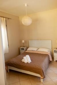 Postel nebo postele na pokoji v ubytování Brunello Seaside Apartments