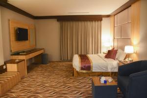 Postel nebo postele na pokoji v ubytování Florida Inn Hotel