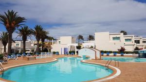 Bazén v ubytovaní CALIMA Lodge Corralejo alebo v jeho blízkosti