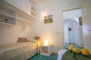 Giường trong phòng chung tại Casa Bianca: delightful apartment in Ravello