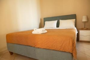 Postel nebo postele na pokoji v ubytování Brunello Seaside Apartments