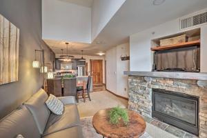 a living room with a couch and a fireplace at Ski-InandOut Snowshoe Retreat with Resort Amenities! in Snowshoe