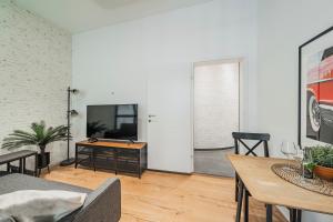 Telewizja i/lub zestaw kina domowego w obiekcie ZEUS Design Apartments Herz