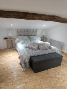 a bedroom with a large bed in a room at Gite De Charme in Ganac