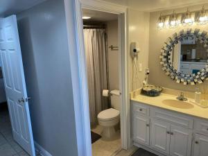 
A bathroom at Charming ocean view condo! Bluewater Resort

