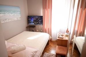Posteľ alebo postele v izbe v ubytovaní Rooms Goga