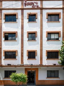 a facade of a building with windows at Hotel Sonora in Mexico City