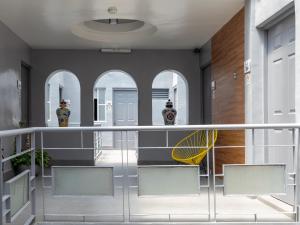 a balcony with two security officers standing in a building at Hotel Sonora in Mexico City