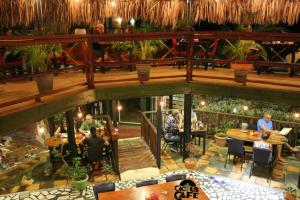 an overhead view of a restaurant with people sitting at tables at Rancho el Sobrino in Sabana Westpunt