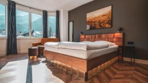 
a bedroom with a bed and a fireplace at Villa Sonnenhof Boutique-Hotel in Bad Reichenhall
