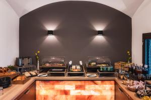a buffet line with many different types of food at Villa Sonnenhof Boutique-Hotel in Bad Reichenhall