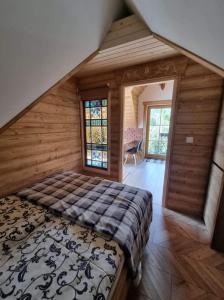 Posteľ alebo postele v izbe v ubytovaní Domek u Gochy