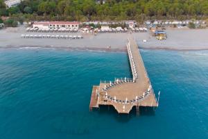 an aerial view of a dock in the water next to a beach at 07 Group Hotel in Alanya