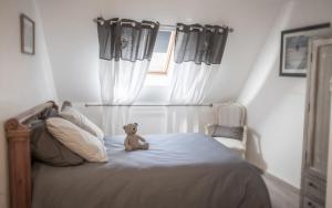 Un pat sau paturi într-o cameră la Gîte de Vernelle - Saint Pierre en Auge