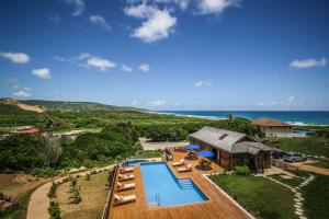 an aerial view of a resort with a swimming pool at Santosha Barbados in Saint Andrew