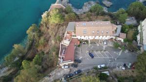 an aerial view of a house on a hill next to the water at Luna Convento Copanello B&B in Stalettì