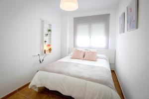 Postel nebo postele na pokoji v ubytování MONTESOL HOME - Parking Gratis + 37 fotografií