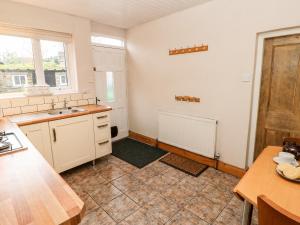 a kitchen with a sink and a counter top at Chare Close Cottage in Haltwhistle