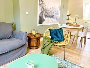 a living room with a couch and a table at Arina & Julien Dieppe in Dieppe