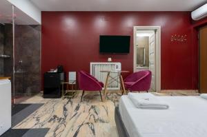 TV a/nebo společenská místnost v ubytování Hotel Ibisco Suites & Relax