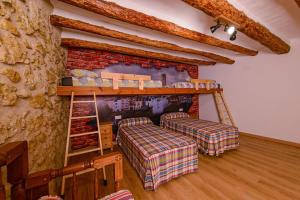 A bed or beds in a room at Habitour - Casa Palmira