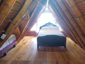 Postel nebo postele na pokoji v ubytování Cabañas El Manglar