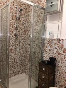 a bathroom with a shower with a glass door at Il Rifugio Del Conte in Bari
