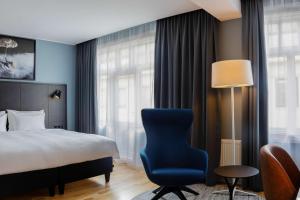 Postel nebo postele na pokoji v ubytování Radisson Blu 1919 Hotel, Reykjavík