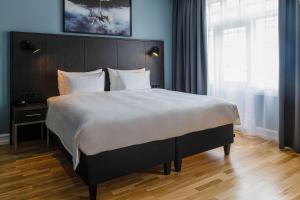 Postel nebo postele na pokoji v ubytování Radisson Blu 1919 Hotel, Reykjavík
